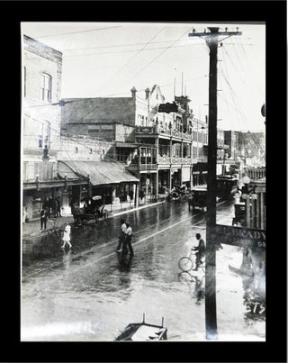 Item #16592 Photograph of Flagler Street 1915, Miami, Florida, After a rain looking across the...
